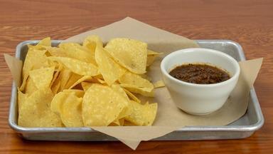 Chips & Salsa · Fire roasted salsa served warm with chips.