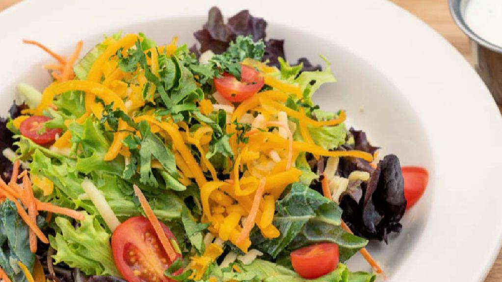 House Salad · Mixed greens, carrots, tomatoes, pepper jack, cheddar, cilantro, choice of dressing.