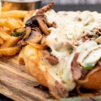 Philly Cheesesteak · Thin sliced sirloin, provolone, peppers, caramelized onions, mushrooms, Italian seasoning, m...