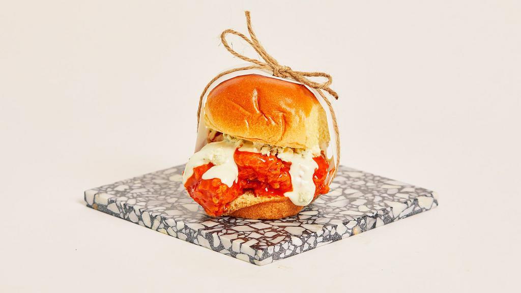 Buffalo Chicken Slider (2) · Crispy fried chicken with buffalo sauce, ranch, and blue cheese crumbles on a toasted bun.