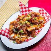 Nocturnal Tower - Buffalo Chicken Waffle F'D Fries · waffle fries topped with jack cheese, fried chopped buffalo chicken, bacon, scallions + ranch.