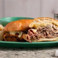 French Dip · Roast beef, dijon spread, Swiss cheese with au jus on a toasted French roll.