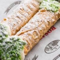 2 Cannolis · Crisp sicilian pastry shells filled with sweetened ricotta and chocolate chips, dipped into ...