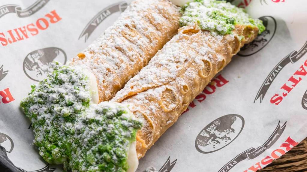 2 Cannolis · Crisp sicilian pastry shells filled with sweetened ricotta and chocolate chips, dipped into mixed nuts and covered with powdered sugar. 540 cal.