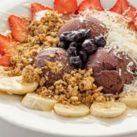 Acai Bowl · Acai sorbet, bananas, strawberries, blueberries, granola, shredded coconut and honey.