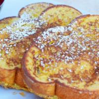 Classics French Toast (2) · Thick slices of batter-dipped egg bread, sprinkled with powdered sugar and served with straw...