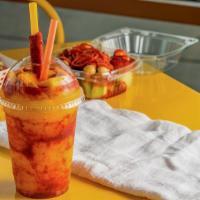 Mangonada · Mango sorbet with chamoy and tajin topped with fresh cut mango and a tamarindo candy straw