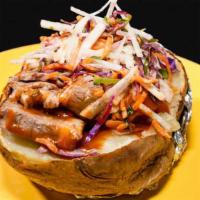 Brisket Potato · Large potato stuffed with  hickory smoked brisket / topped with  cheese / BBQ sauce.