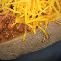 Chili & Cheese Potato · Large baked  potato stuffed with chili / topped with  cheese/ BBQ sauce.