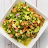 Shirazi Salad · Chopped Persian cucumber, tomato, cilantro, and red onion with a special lemon dressing.