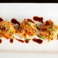 Showtime Roll · Spicy. Soy paper. Inside: spicy crab, shrimp tempura, cream cheese, cucumber. On top: avocad...