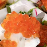 Salmon Caviar Crostini · Salmon roe, mint labneh, microgreens, Greek pita crostini