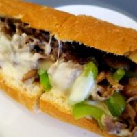 Philly Cheese Steak · THINLY SLICED TRI-TIP TOPPED WITH SAUTEE GREEN  PEPPERS, MUSHROOMS & ONIONS TOPPED WITH MELT...