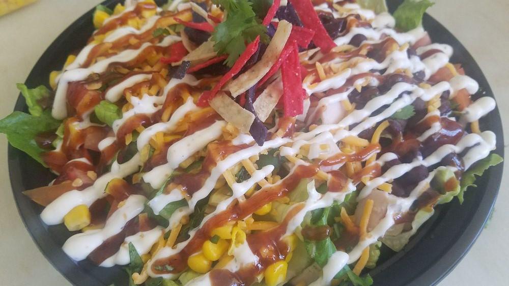 Bbq Chicken Ranch Salad · BLACK BEANS, CORN, CILANTRO, TOMATOES, CHEDDAR CHEESE& CHICKEN BREAST WITH DRIZZLED BBQ SAUCE & RANCH DRESSING TOPPED WITH TORTILLA STRIPS