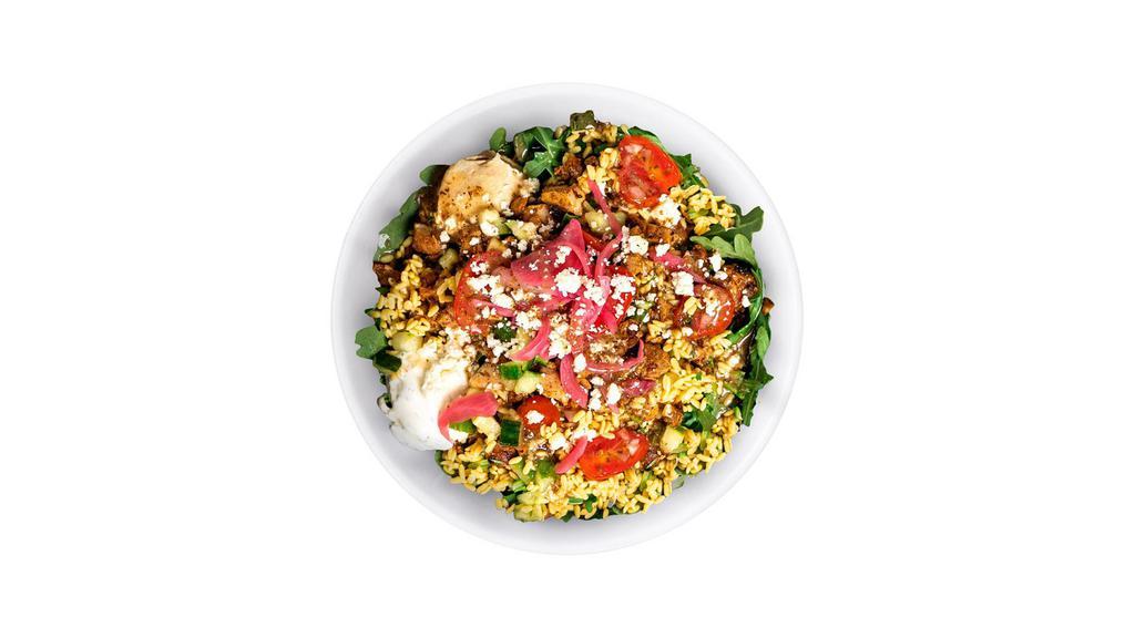 Chicken & Rightrice® · A bowl built on a base of lower-carb, protein-packed RightRice with Arugula, Chicken, Tzatziki, Hummus, Feta, Cucumber, Tomato + Onion, and Pickled Onion. Finished with Greek Vinaigrette.
