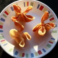 Cream Cheese Wonton (3) · Crispy wonton skin wrapped around a dollop of cream cheese with a hint of imitation crab mea...