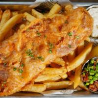 Fish And Chips · Beer battered fish fillet served with tartar sauce, lemon and spicy bacon green peas.