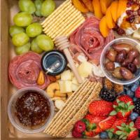 Charcuterie Box · Chef's choice of 2 cheeses, 2 meats, crackers, honey & Jam, variety of nuts & fruits.