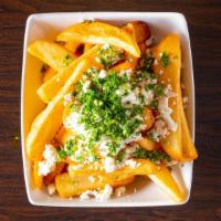Mediterranean Style Fries · Fried with a sprinkle of paprika, salt, feta cheese and parsley.