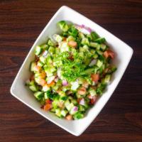 Shirazi Salad · Fresh cucumber, tomato, parsley, red onions & dressing.