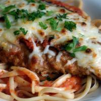 Chicken Parmigiana · Breaded chicken breast topped with Marinara sauce and Mozzarella cheese with side spaghetti