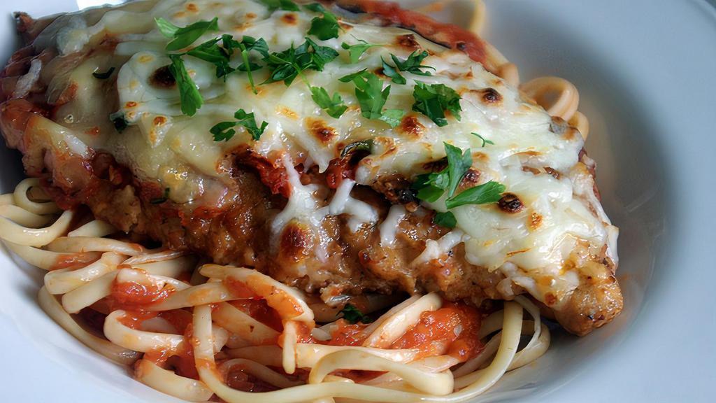 Chicken Parmigiana · Breaded chicken breast topped with Marinara sauce and Mozzarella cheese with side spaghetti