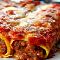 Cannelloni (Meat) · Crepes filled with meat and topped with marinara sauce and mozzarella cheese