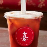 Joy Fresh Fruit Tea · Fresh cut fruit with a touch of Passionfruit Jam, shaken with Black Tea.