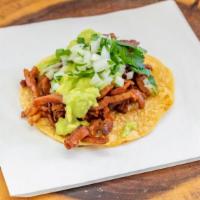 Mini Taco Al Pastor  · Handmade tortilla street taco, meat,  guacamole, onion & cilantro