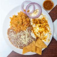 Huevos Rancheros · Perfectly cooked eggs in green salsa.
