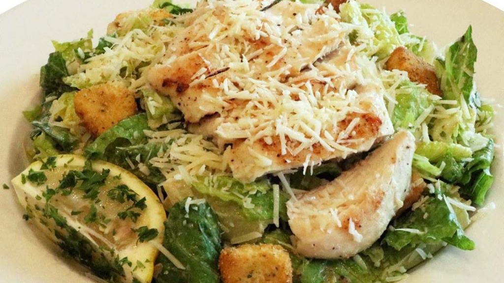 Chicken Caesar Salad · Fresh romaine, tender grilled chicken, shredded Parmesan cheese, croutons, and caesar dressing.