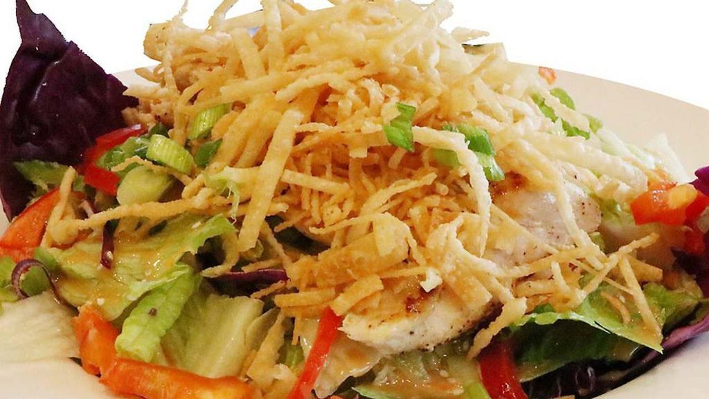 Chinese Chicken Salad · Fresh salad mix, celery, green onions, red bell peppers, red cabbage, and crisp wonton strips, tossed with our original Asian dressing and topped with a freshly grilled chicken breast.