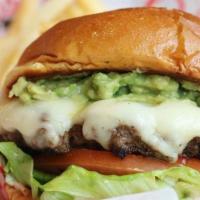 Guacamole Burger · Topped with a generous portion of housemade guacamole, two slices of Swiss cheese, crisp let...