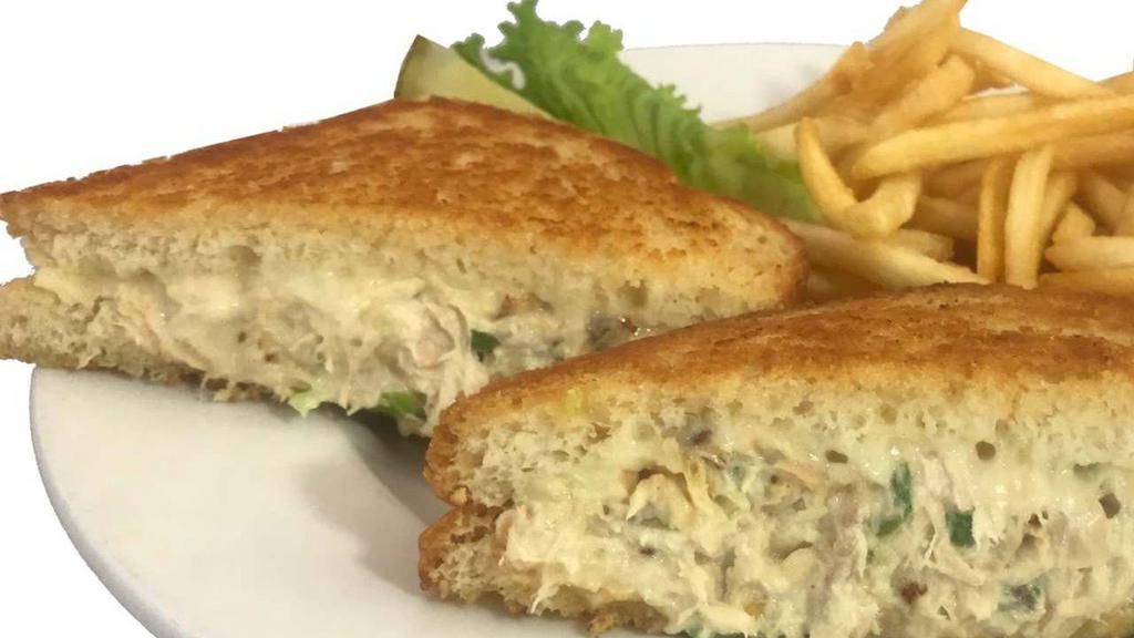 Albacore Melt · Our freshly made albacore salad served on crunchy, golden-grilled sourdough with melted slices of American and Swiss cheese, our solid white albacore tuna is dolphin safe!