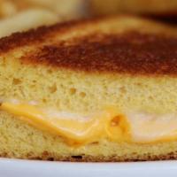 Texas Grilled Cheese · The ultimate grilled cheese sandwich! Slice after slice of melted American and Swiss cheese ...