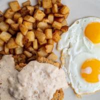 Country-Fried Steak & Eggs* · Not one, but two tender steaks, battered and fried golden brown and topped with Coco's sausa...