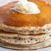 Buttermilk Pancakes · Freshly made buttermilk pancakes served with syrup..