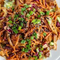 Spicy Asian Chicken Salad · Diced chicken breast, crispy wontons, carrots and red cabbage tossed in our signature Asian ...