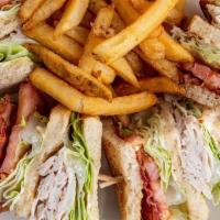 Coco'S Club · Hand-carved turkey breast, Applewood-smoked bacon, lettuce, tomatoes and mayo on thick cut s...