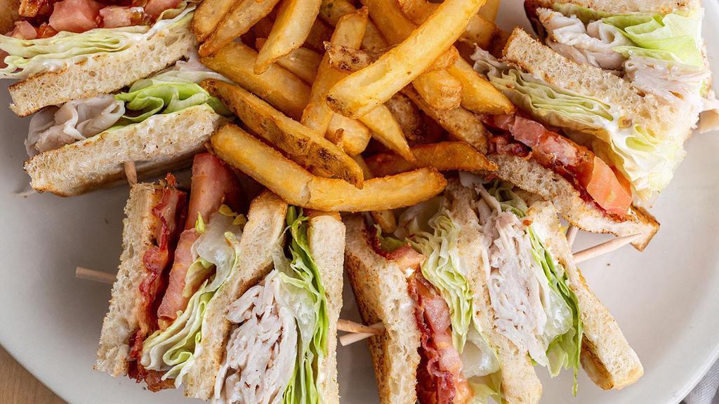 Coco'S Club · Hand-carved turkey breast, Applewood-smoked bacon, lettuce, tomatoes and mayo on thick cut sourdough. Served with choice of side.
