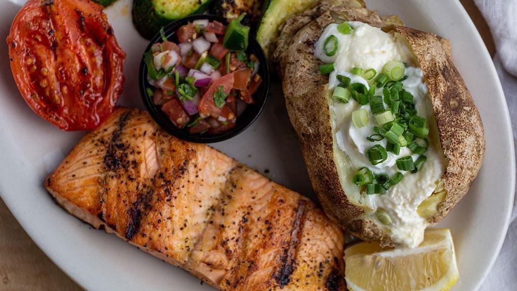 Grilled Atlantic Salmon · Lightly seasoned grilled atlantic salmon served with choice of 2 sides.