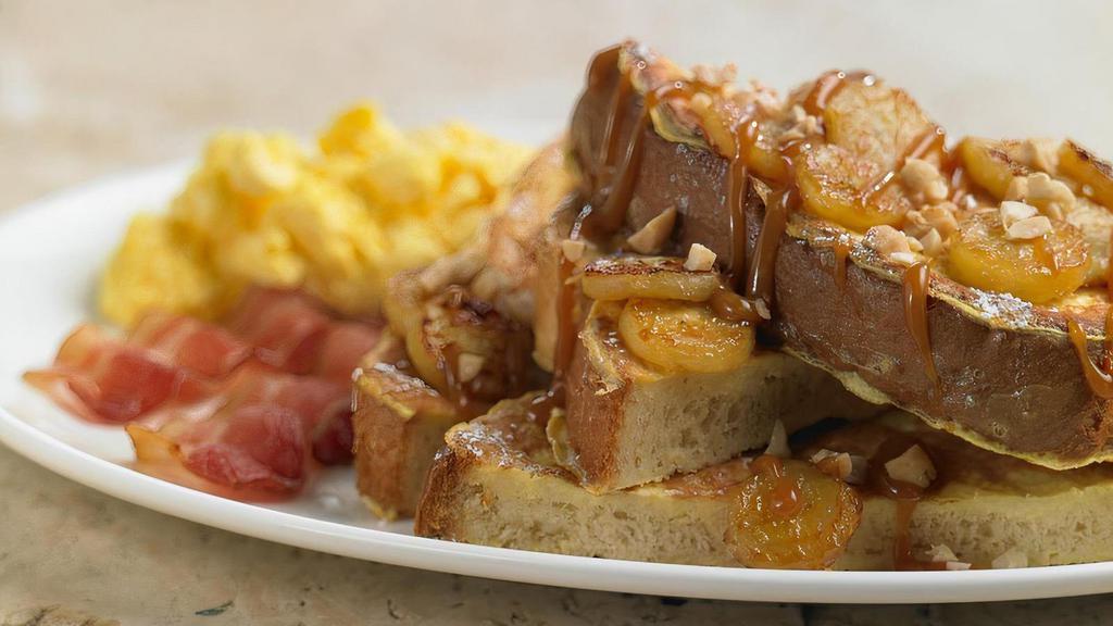 55 Brioche French Toast · Rich brioche bread makes our French toast light, fluffy and decadent dipped in our creamy French toast batter and grilled to perfection. Served with syrup.