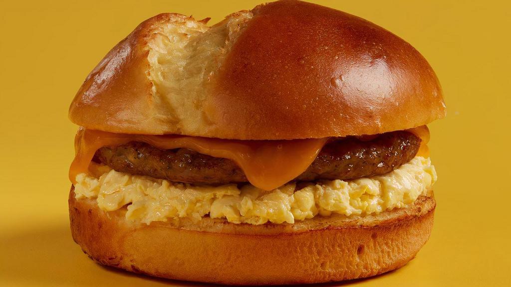 55 Classic Breakfast Sandwich · Potato bun with creamy scrambled eggs*, cheese and choice of protein and side.
