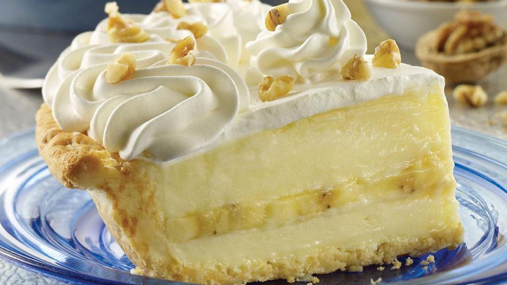 Whole Banana Cream Pie · Fresh bananas are sliced and layered with a fresh vanilla cream filling, topped with whipped cream and lightly toasted walnuts, all in a flaky pie crust.