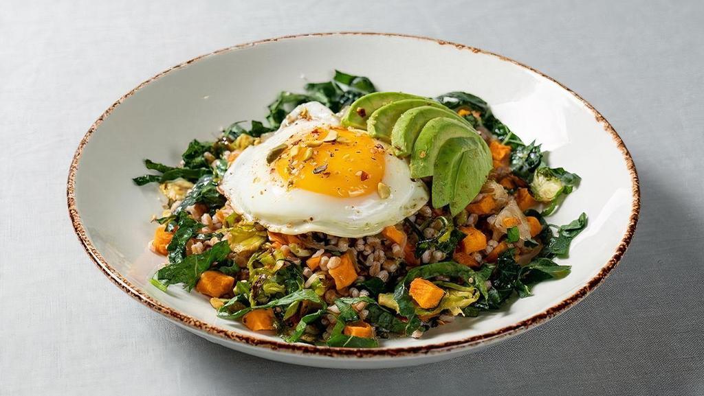 Sunny Side Breakfast Bowl · organic sunny-side egg, avocado, caramelized onion, roasted Brussels sprouts and sweet potato, farro, massaged kale, citrus-cumin salt, pistachio dukkah. This item contains nuts.