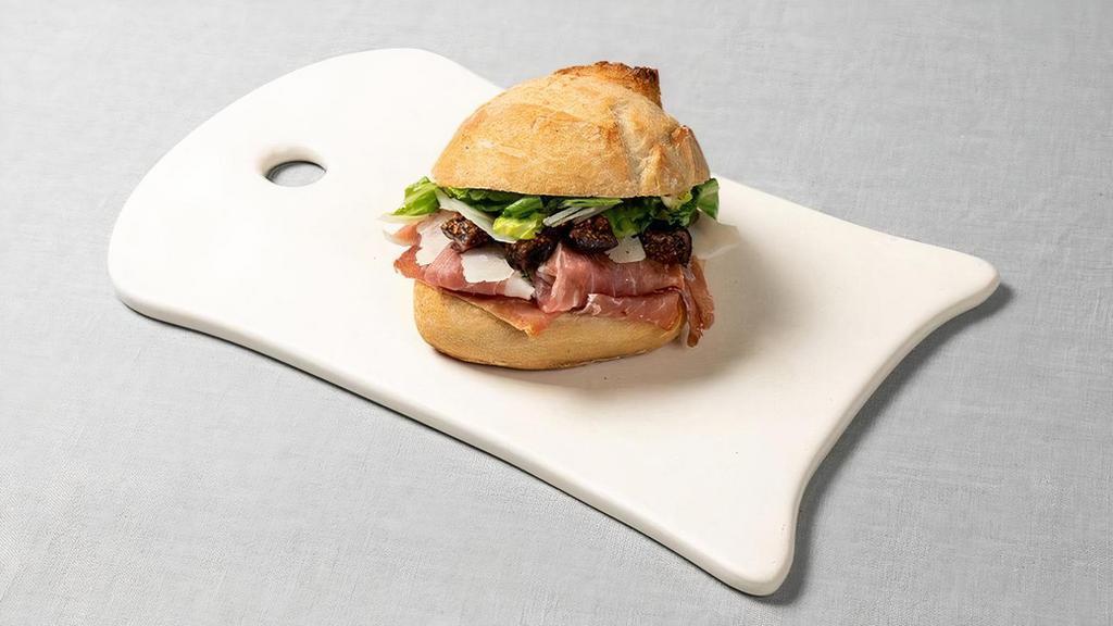 Prosciutto Manchego Sandwich · with dried figs and mustard butter on a French roll.  Modify your order and add a mixed green salad