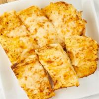 Cheesy Garlic Bread · French bread with garlic butter and our 3 cheese blend.