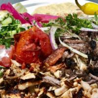 Mix Gyro Plate Chicken And Beef · Thinly carved marinate chicken & beef cooked on a vertical broiler served with rice, hummus,...