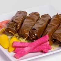 Veggie Grape Leaves · Grape Leaves Stuffed with rice, tomato, onions, parsley and fresh lemon juice.