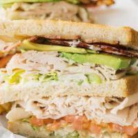 Cali Club · A double decker turkey sandwich, white cheddar, premium bacon, avocado, lettuce and tomatoes...
